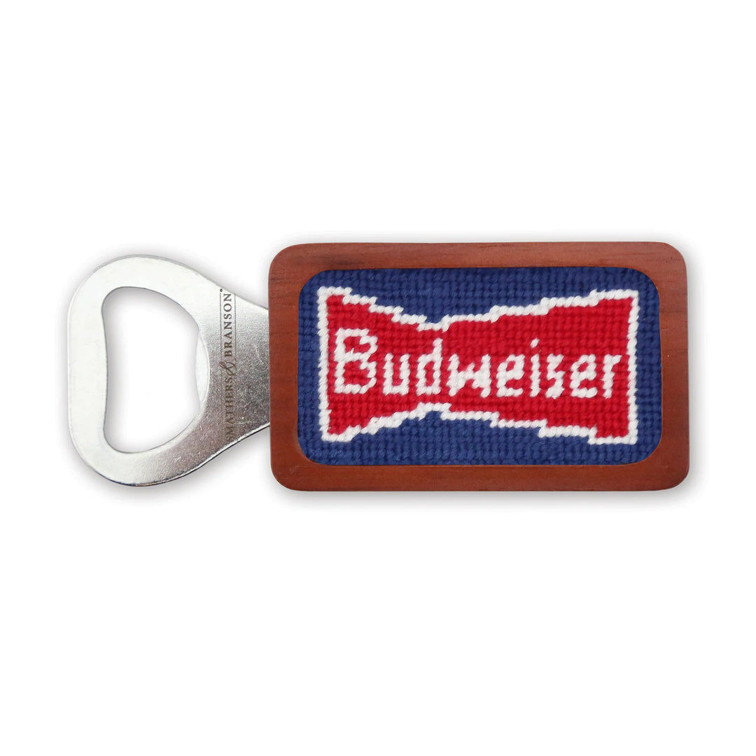 A Budweiser vintage bowtie bottle opener with a wooden handle.