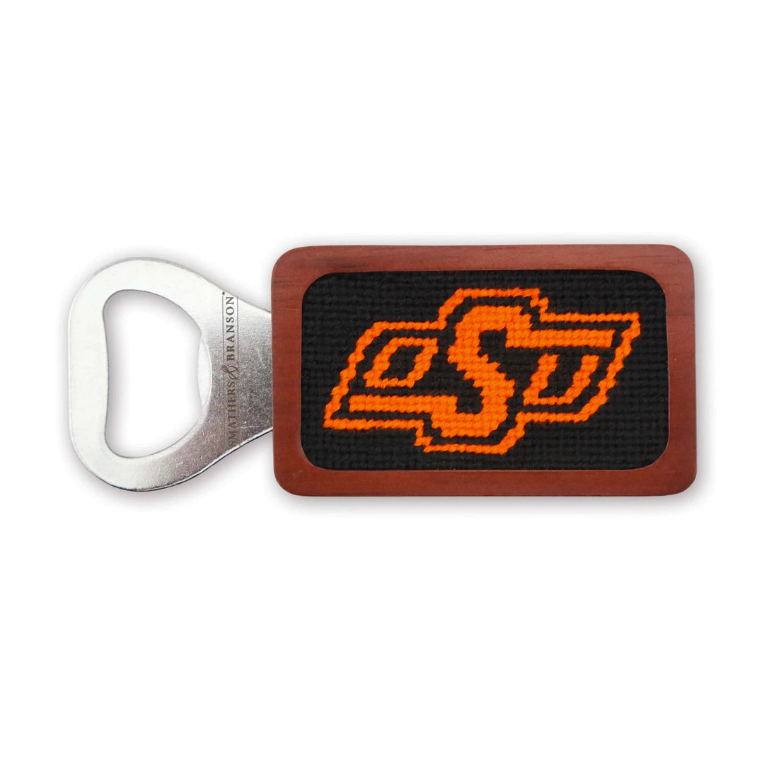 Oklahoma State bottle opener with a needlepoint OSU logo and a wooden handle.