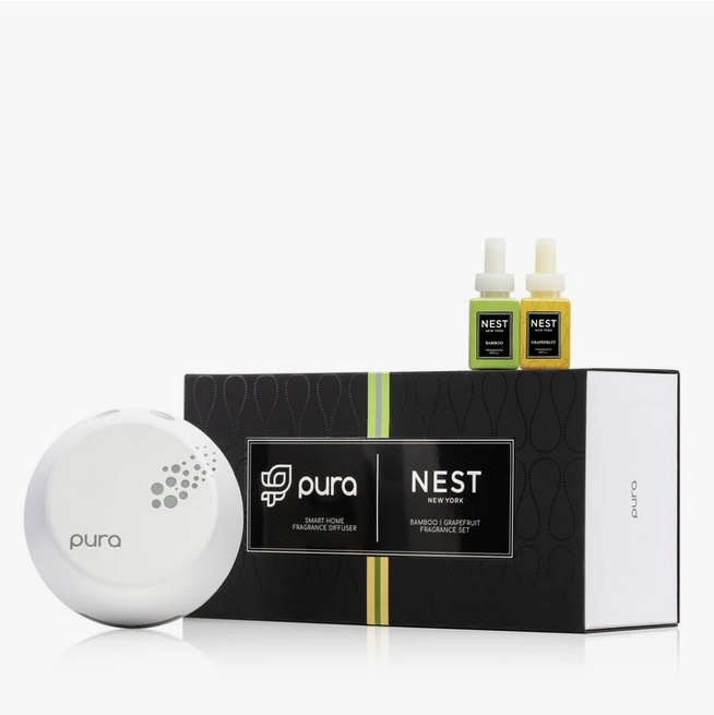 A Pura smart home diffuser set with a white diffuser and two fragrance vials.