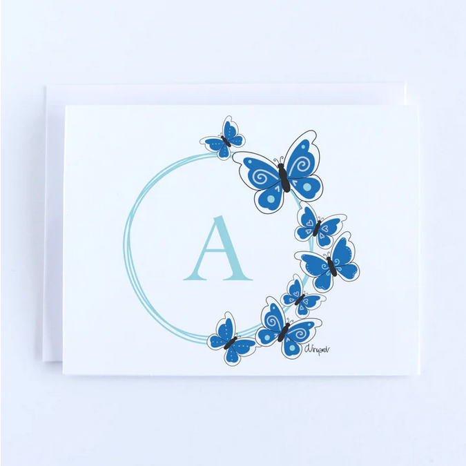 A white notecard with a light blue letter A encircled by blue butterflies.