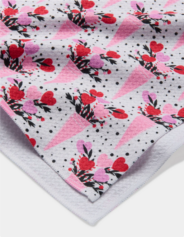 Love Bouquet Tea Towel with a pattern of pink cones holding heart bouquets.