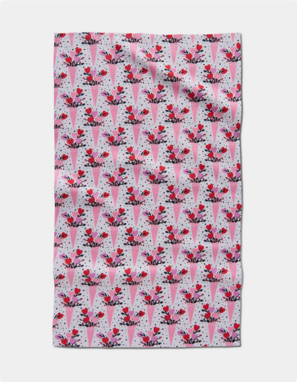 Love Bouquet Tea Towel with a pattern of pink cones filled with red and pink hearts.