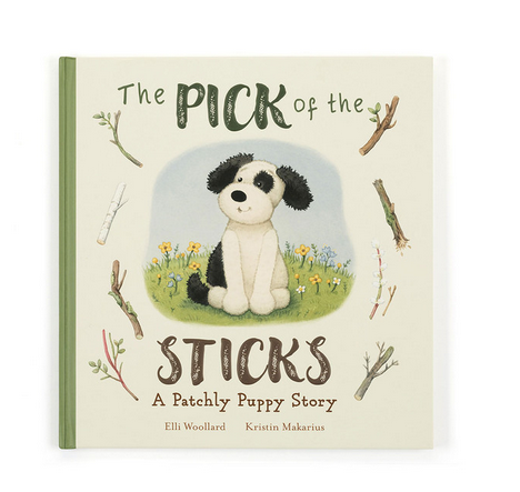The Pick of the Sticks children's book features a black and white puppy surrounded by sticks.