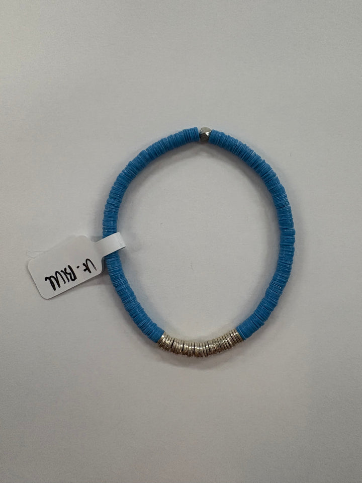 A blue flat bead bracelet with silver-plated accent beads and a small tag.