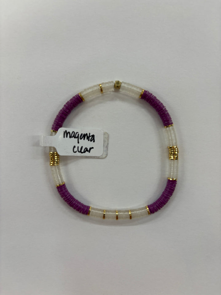 Small flat bead bracelet with magenta and clear beads, and gold accents.