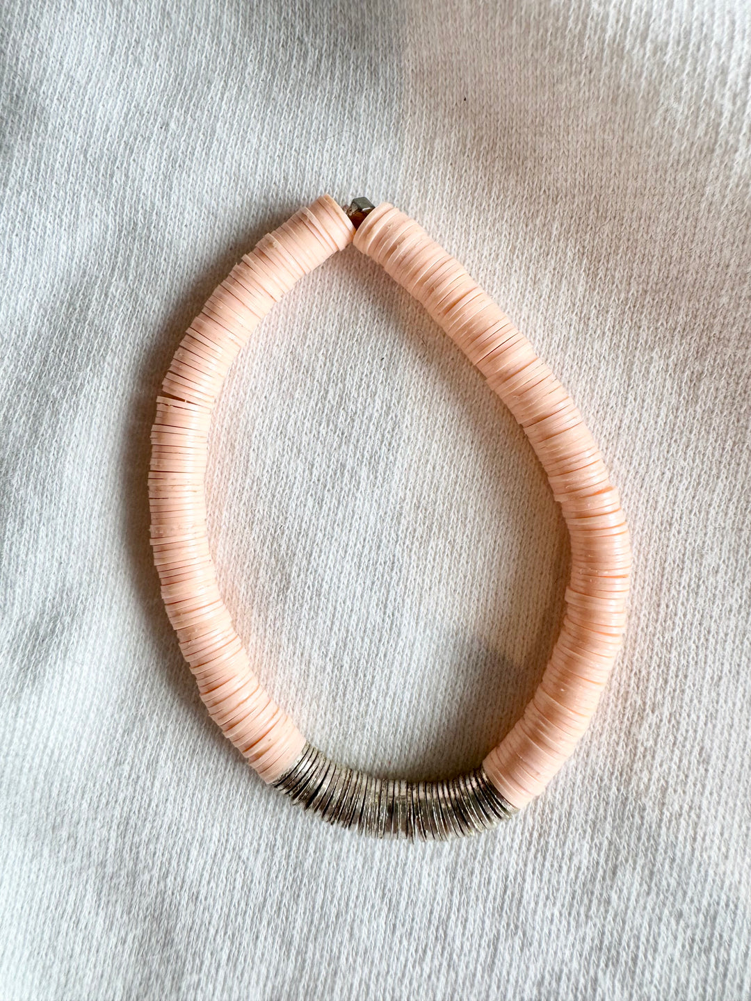Large Flat Bead Bracelet with peach vinyl beads and silver-plated accents.