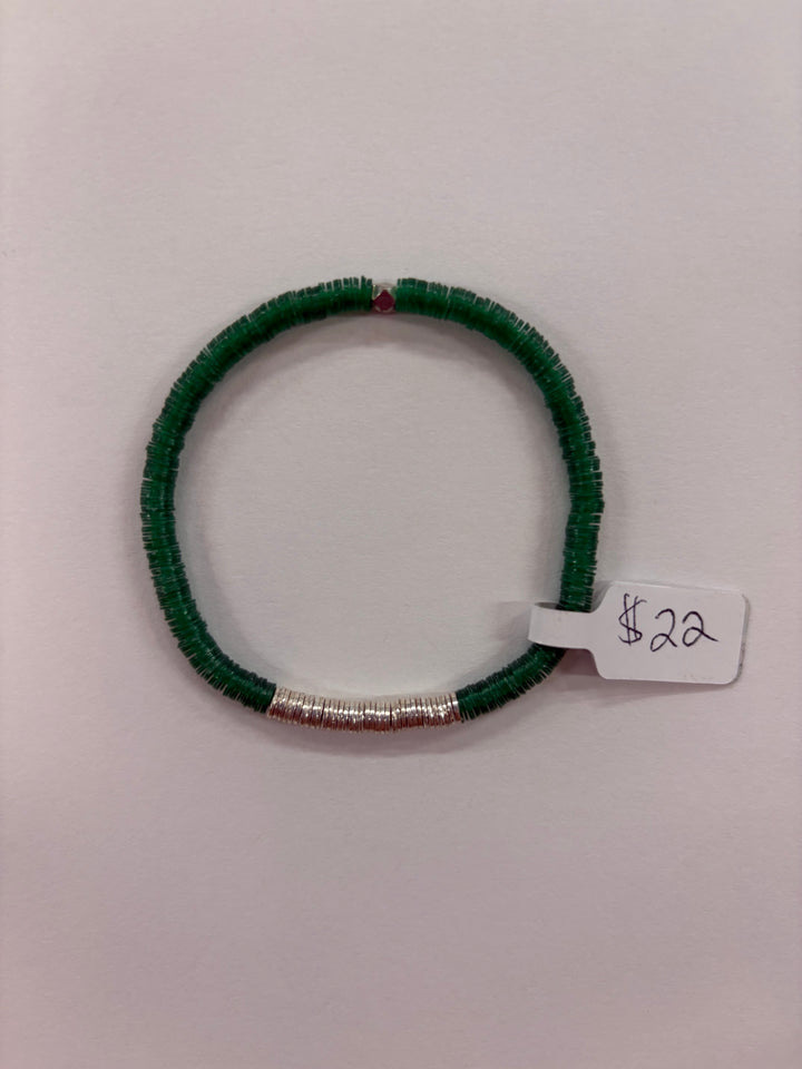 A green flat bead bracelet with a section of silver-plated beads and a single red bead.