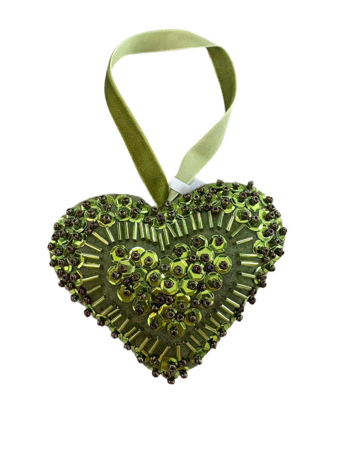 Green heart-shaped ornament, hand-beaded with sequins and small beads, hanging from a velvet ribbon.