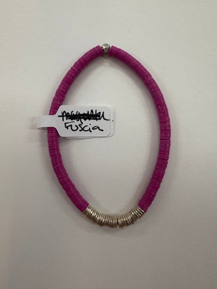 Small flat bead bracelet in fuscia with silver accents.