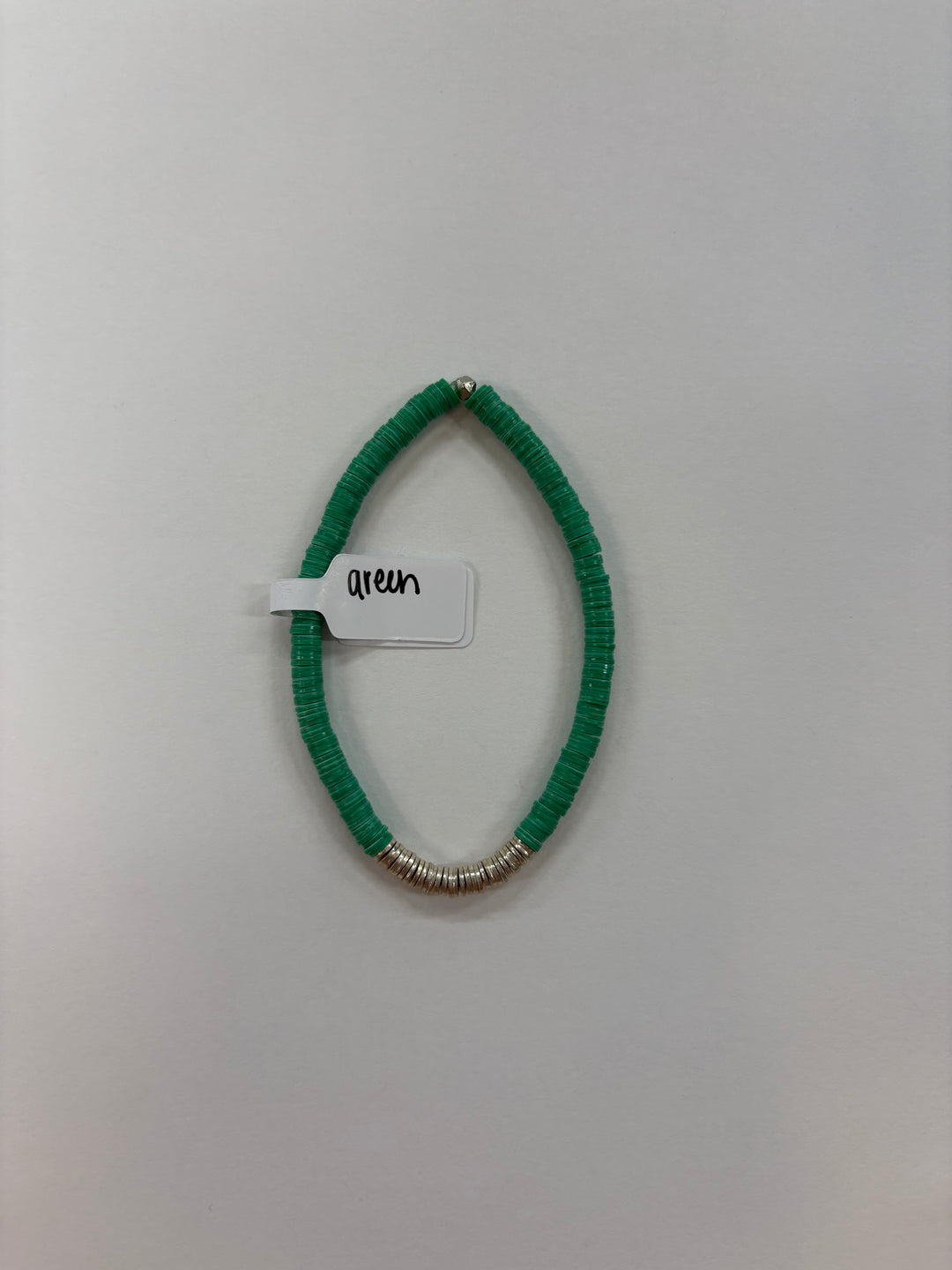 Small flat bead bracelet with green beads and silver-plated accents.