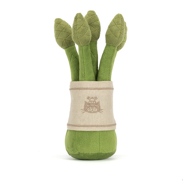 A plush toy asparagus with a woven band and a cat design.