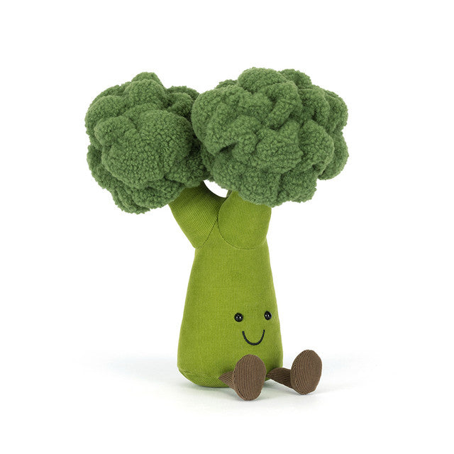 A plush broccoli toy with a smiling face and two green florets.