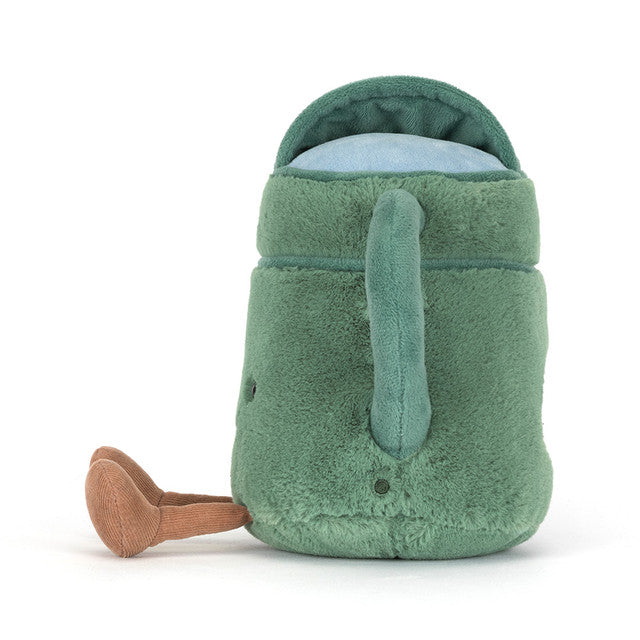 A green plush watering can toy with a blue lid and tan legs.