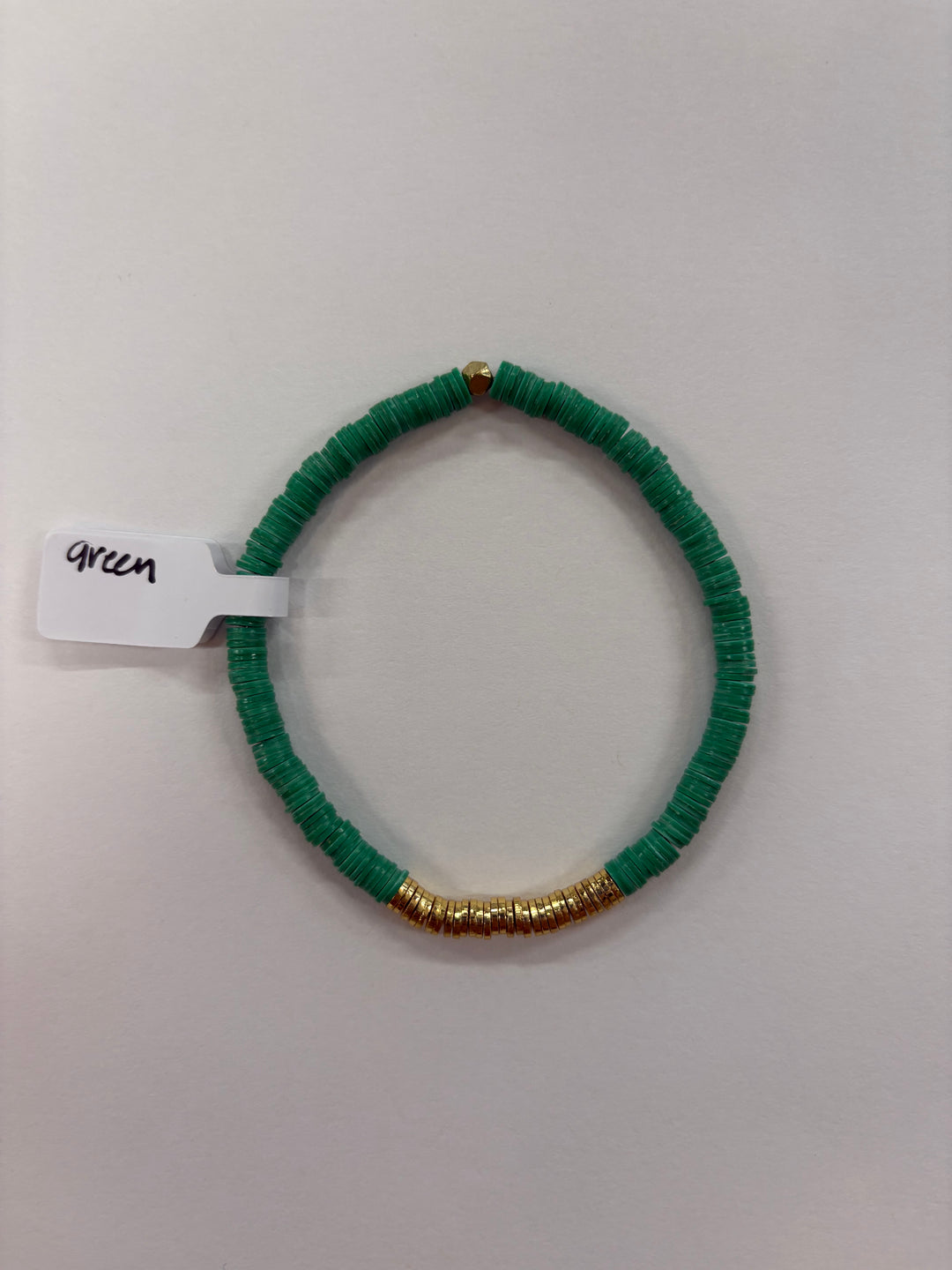 Small flat bead bracelet with green vinyl beads and gold-plated accents.