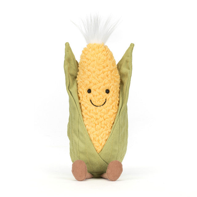 A plush toy corn cob with a smiling face and green husk.
