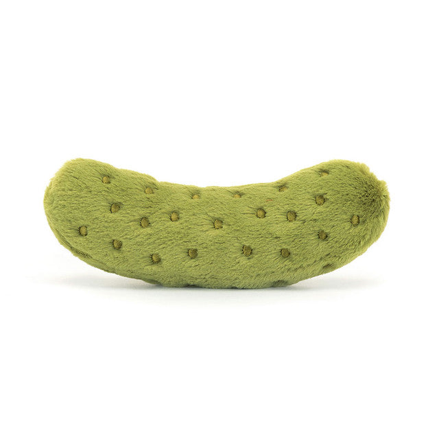A plush green pickle toy with small brown dots.