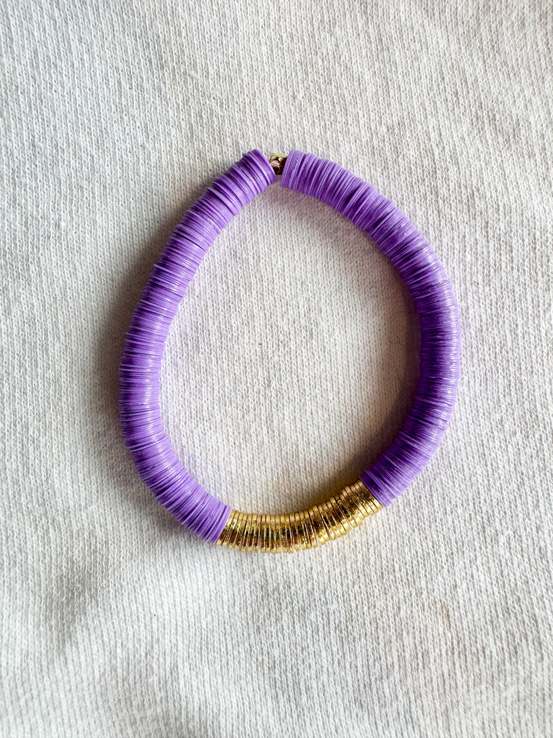 Large flat bead bracelet with purple vinyl beads and gold-plated accents.