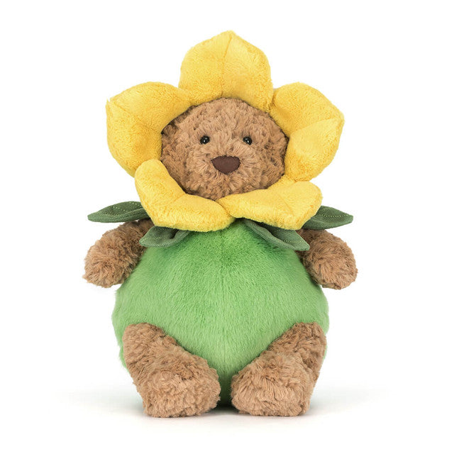 A brown teddy bear wearing a yellow daffodil costume with green leaves.
