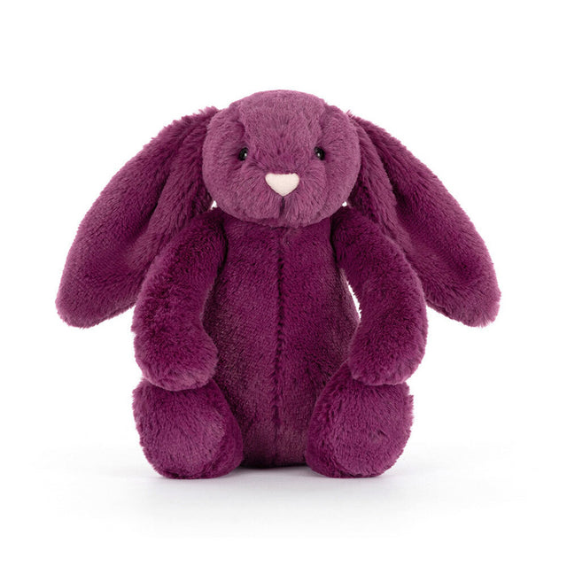 A plush purple bunny with long floppy ears sits facing forward.