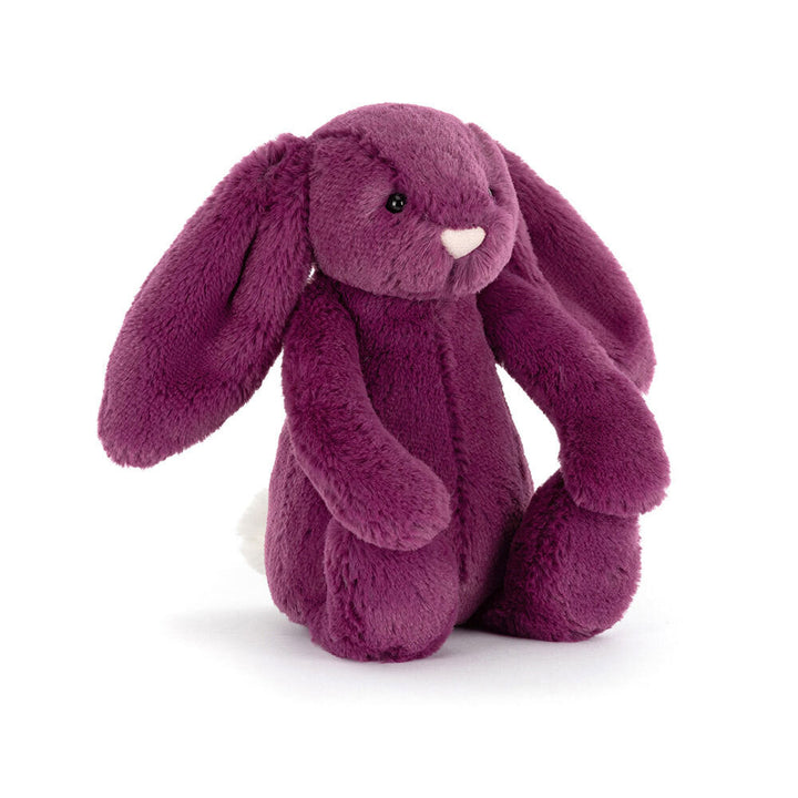 A plush purple bunny with long floppy ears and a white fluffy tail.