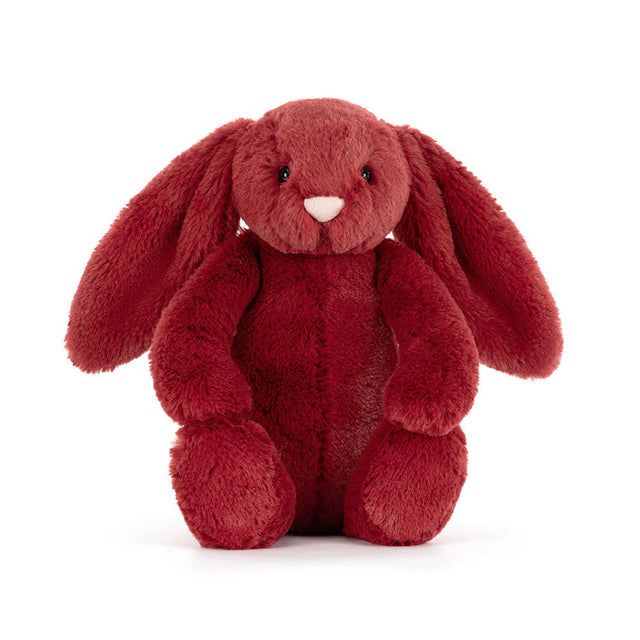 A plush redcurrant bunny with long ears and a pink nose sits facing forward.