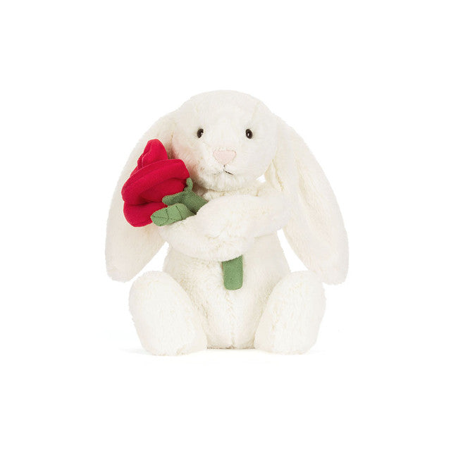 Cream bunny holding a red rose.