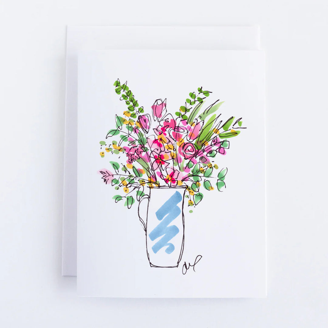A white notecard features a watercolor illustration of pink and orange flowers in a blue pitcher.