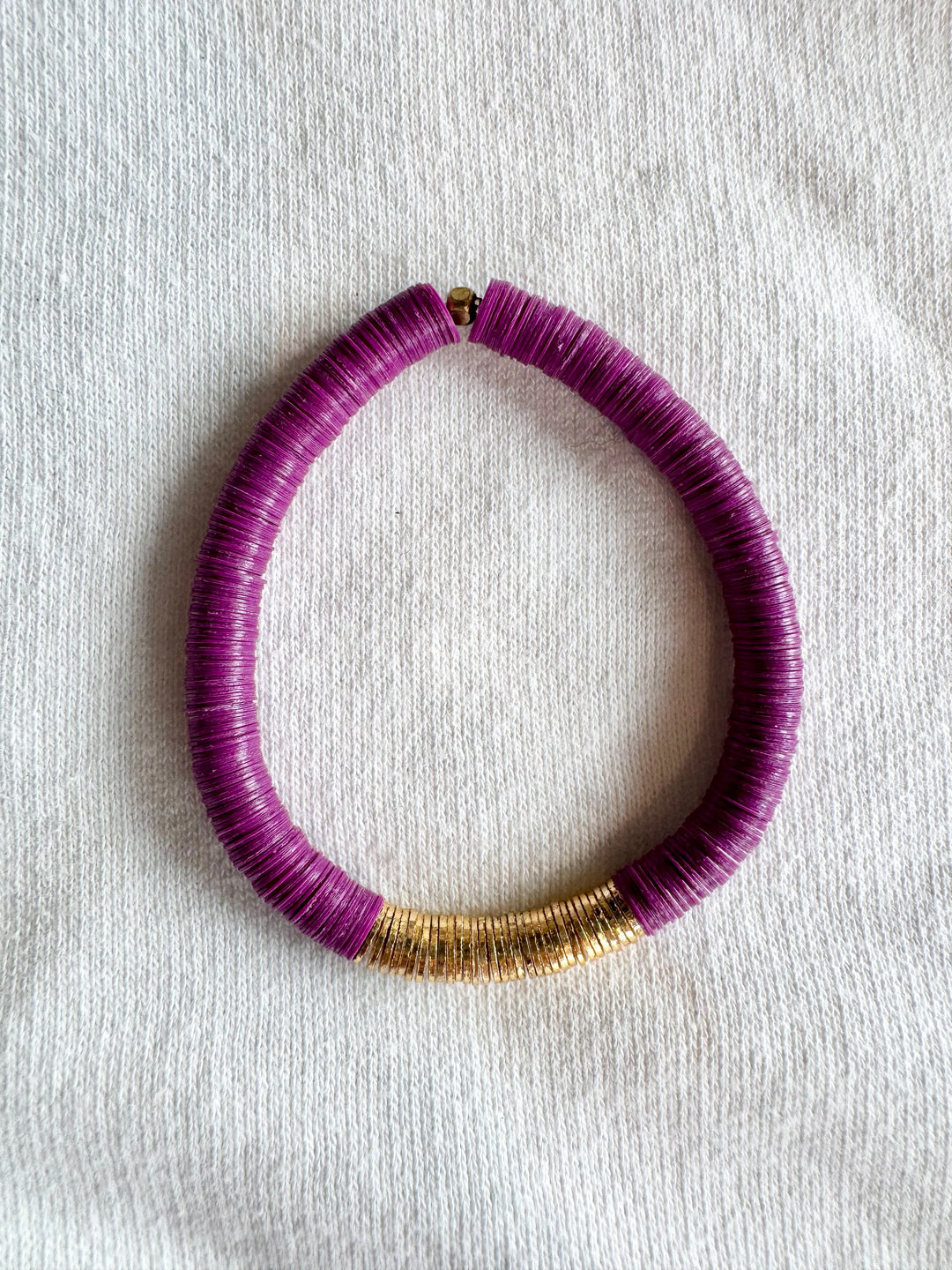 Large flat bead bracelet with purple vinyl beads and gold-plated accents.