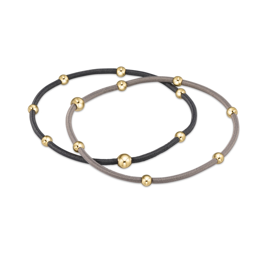 Two elastic hair ties with gold beads, one gray and one black.