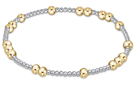 A mixed metal beaded bracelet with alternating gold and silver beads.