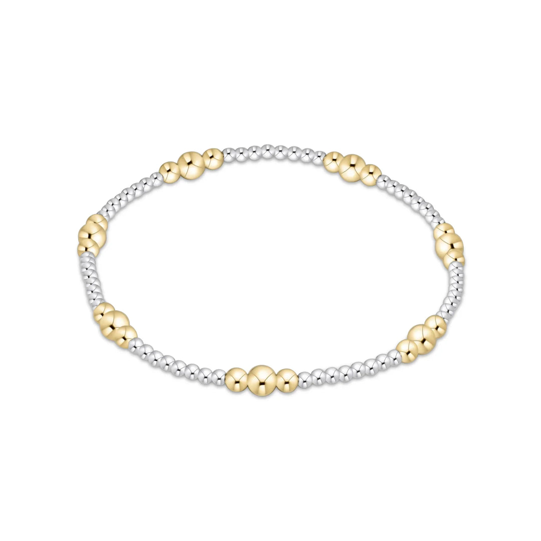 Mixed metal beaded bracelet with gold and silver beads.