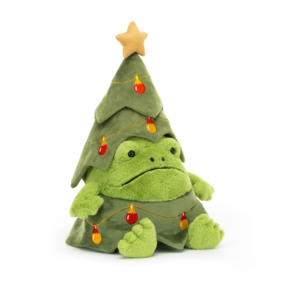 A plush green frog sits wearing a Christmas tree costume with a star and baubles.