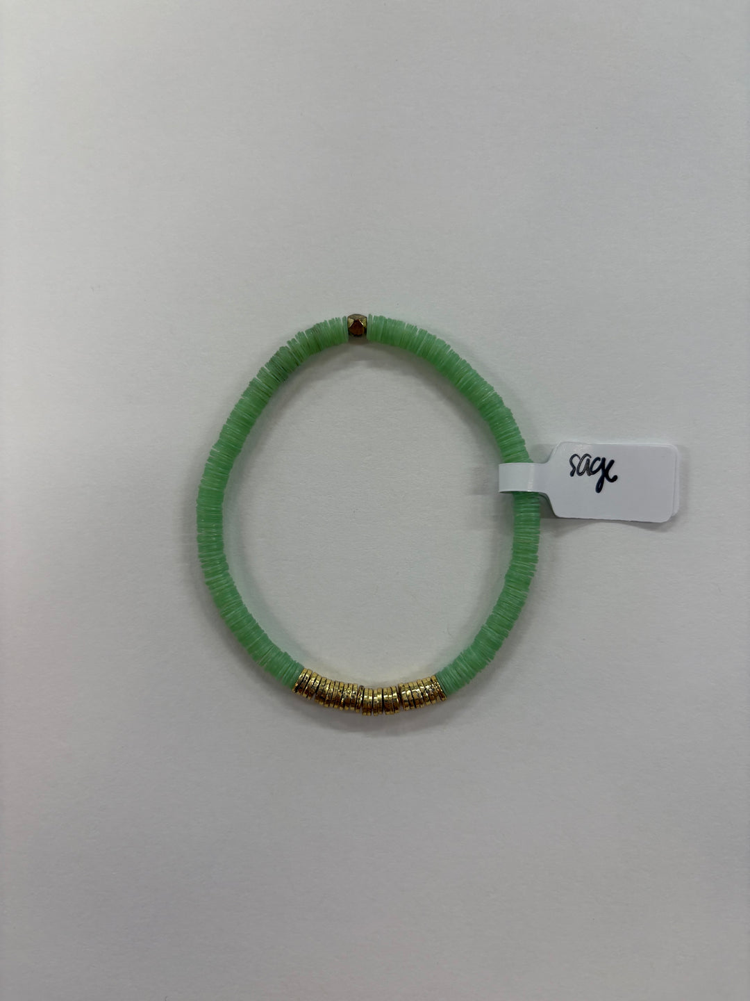 Small flat bead bracelet with sage green vinyl beads and gold accents.