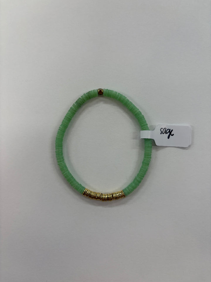 Small flat bead bracelet with sage green vinyl beads and gold accents.