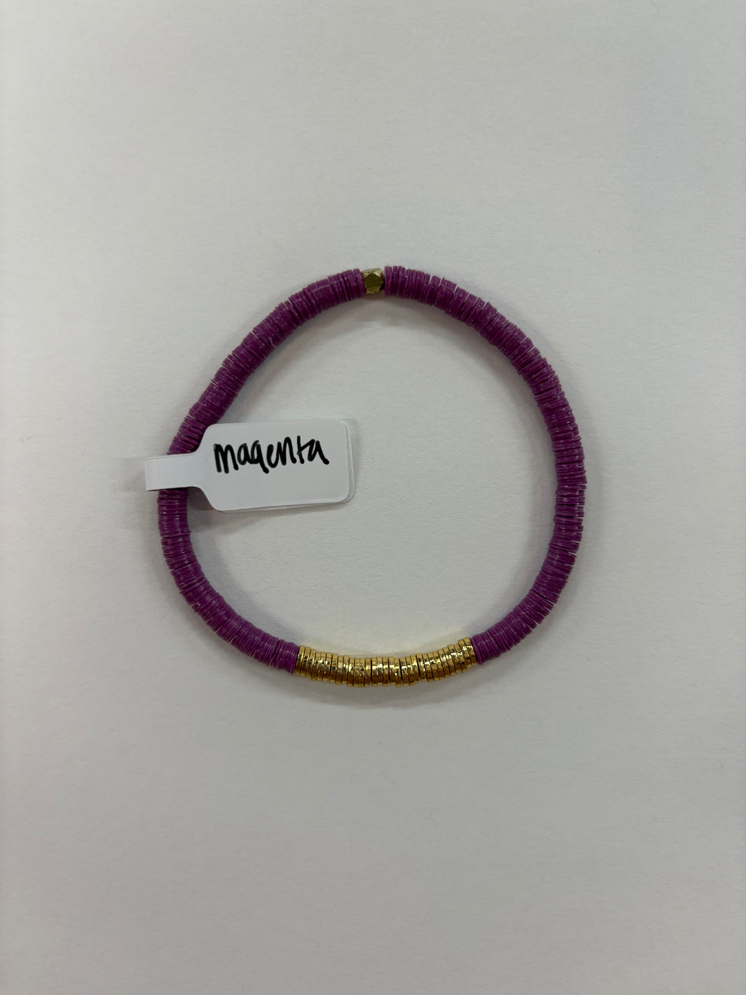 Small Flat Bead Bracelet in magenta with gold accents.