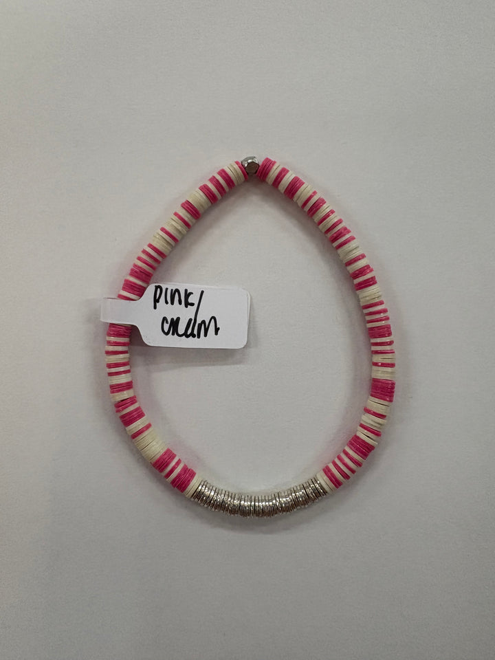 Small flat bead bracelet with pink and cream vinyl beads and silver-plated accents.