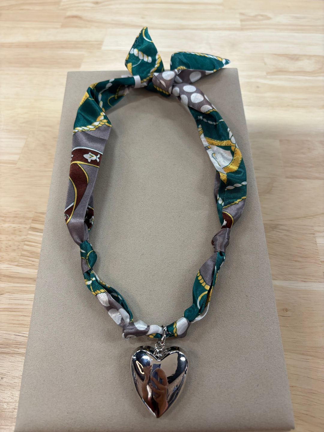 Tatum satin scarf necklace with a silver heart charm.