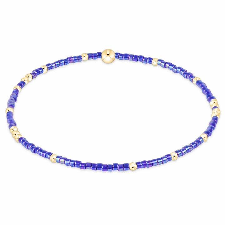 Blue metallic seed bead bracelet with gold-filled beads.