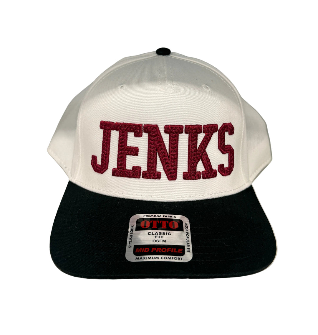 Jenks embroidered canvas hat with white crown and black bill.