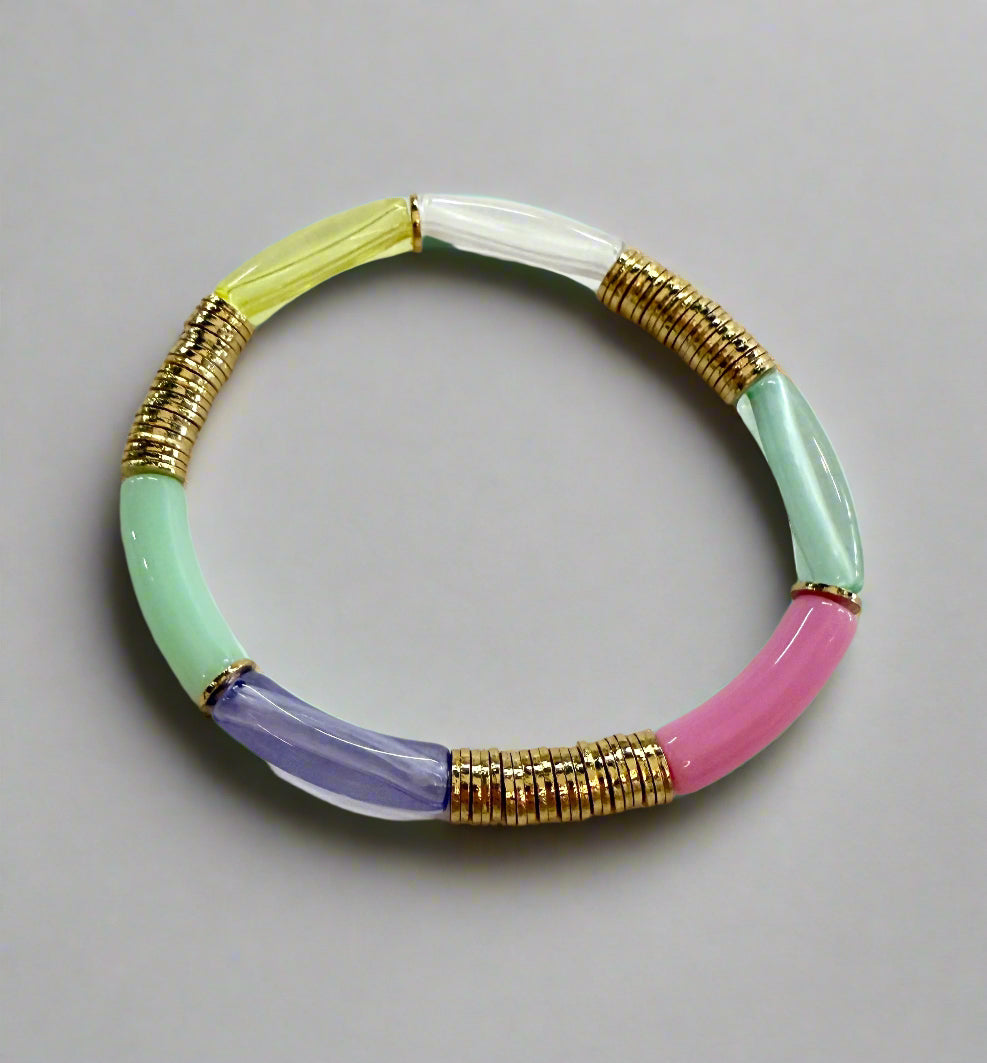 A colorful noodle bracelet with gold-plated disc beads.