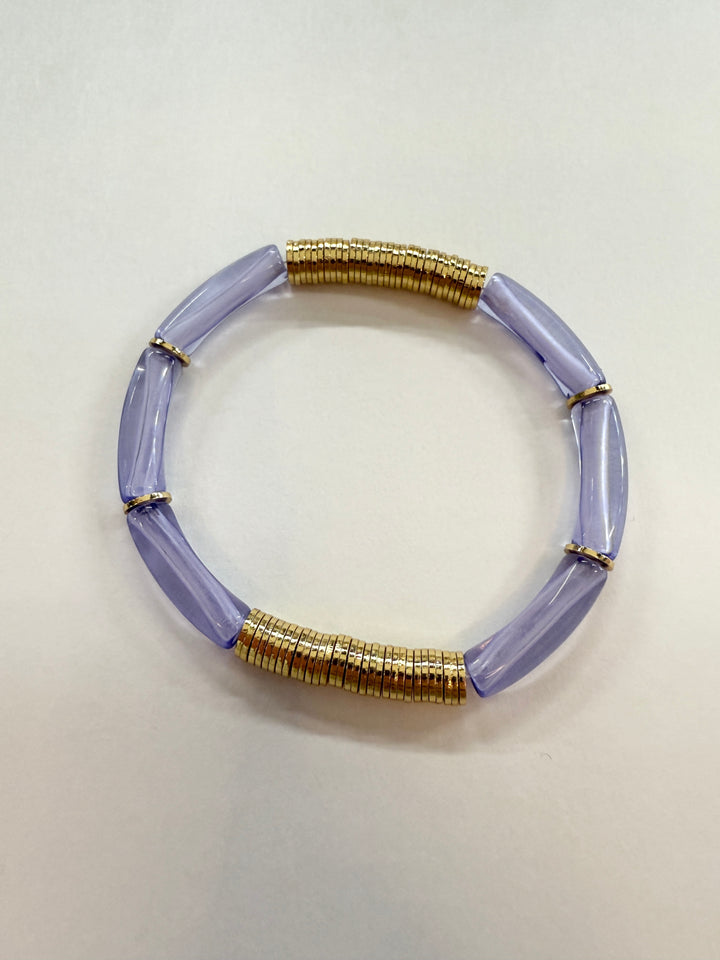Noodle bracelet with translucent purple acrylic beads and gold-plated disc beads.