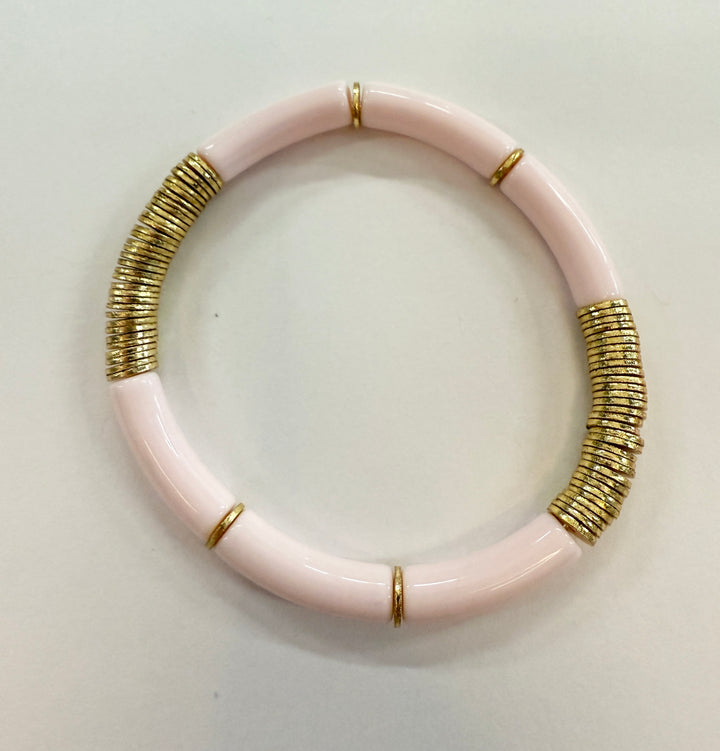 Pink noodle bracelet with gold disc beads.