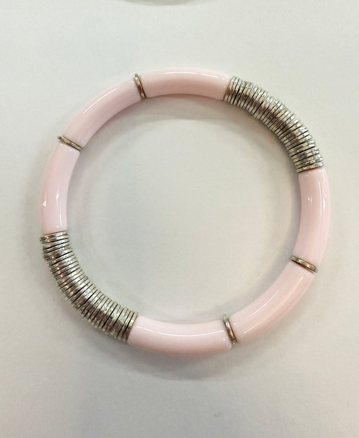 Pink noodle bracelet with silver-plated disc beads.