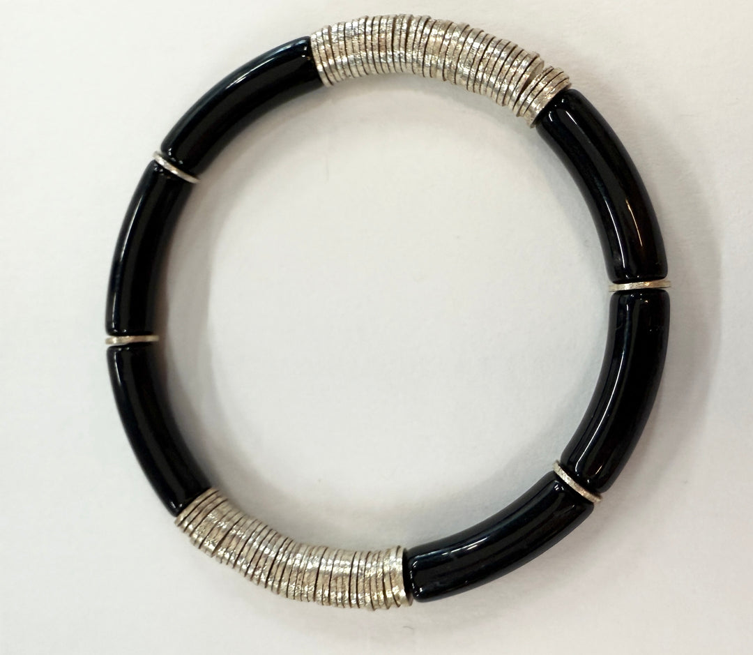 Noodle bracelet with black acrylic beads and silver-plated disc beads.