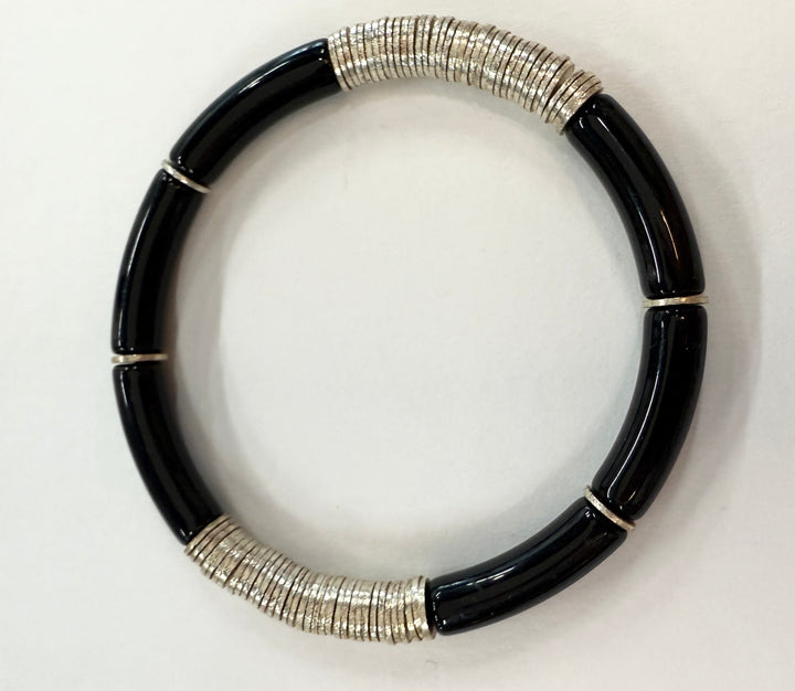 Noodle bracelet with black acrylic beads and silver-plated disc beads.