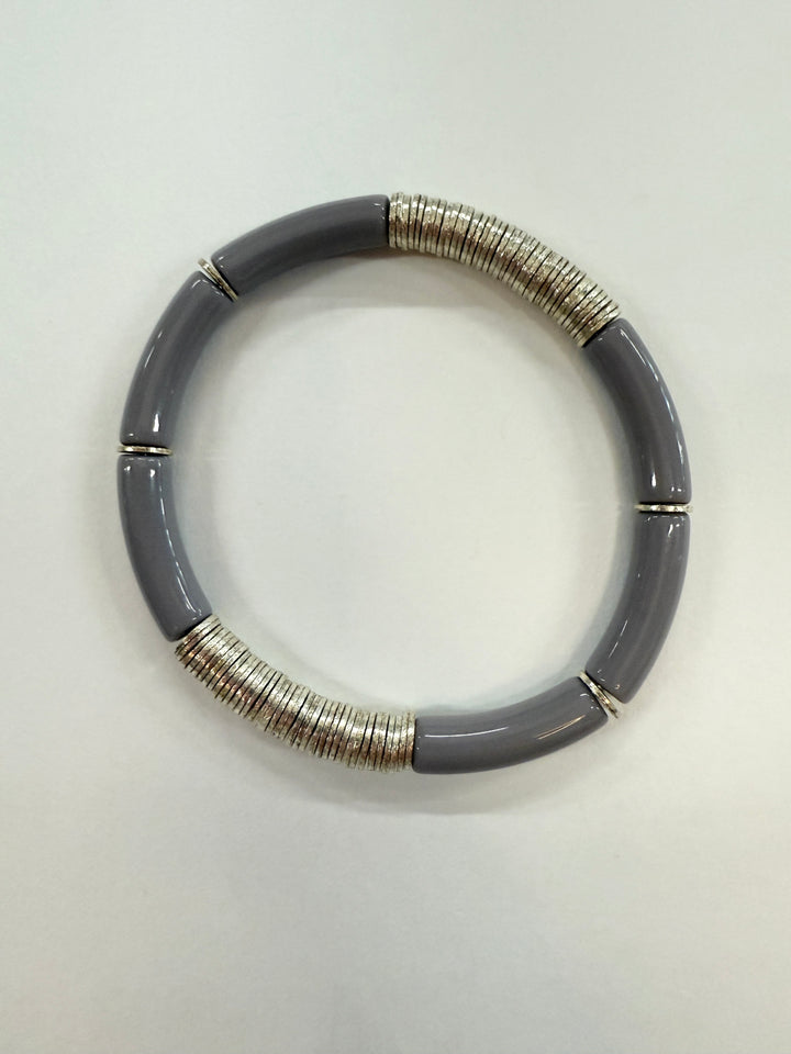 A gray noodle bracelet with silver-plated disc beads.