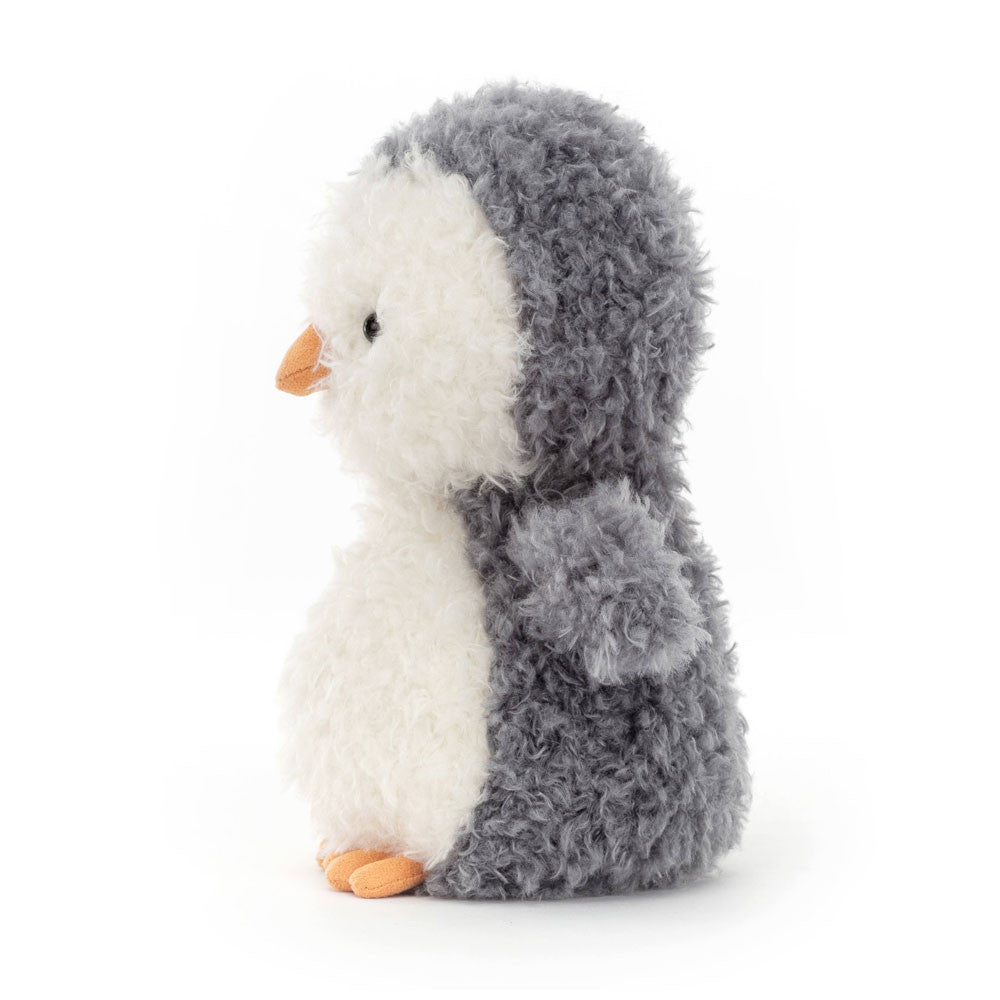 A fluffy gray and white penguin plush toy with an orange beak and feet, facing left.