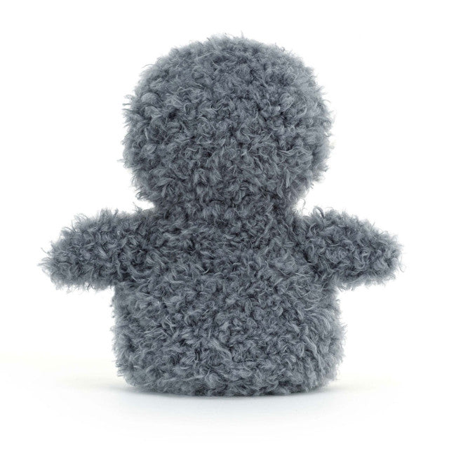 A gray, fluffy penguin plush toy is shown from the back.
