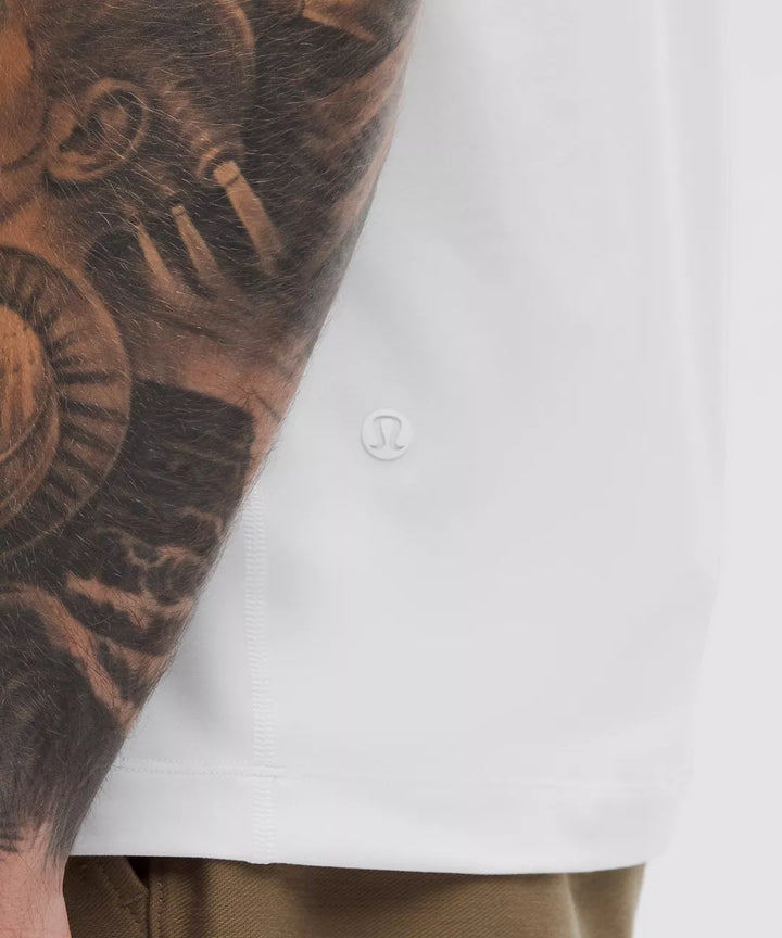 White short-sleeve shirt with a subtle logo detail.