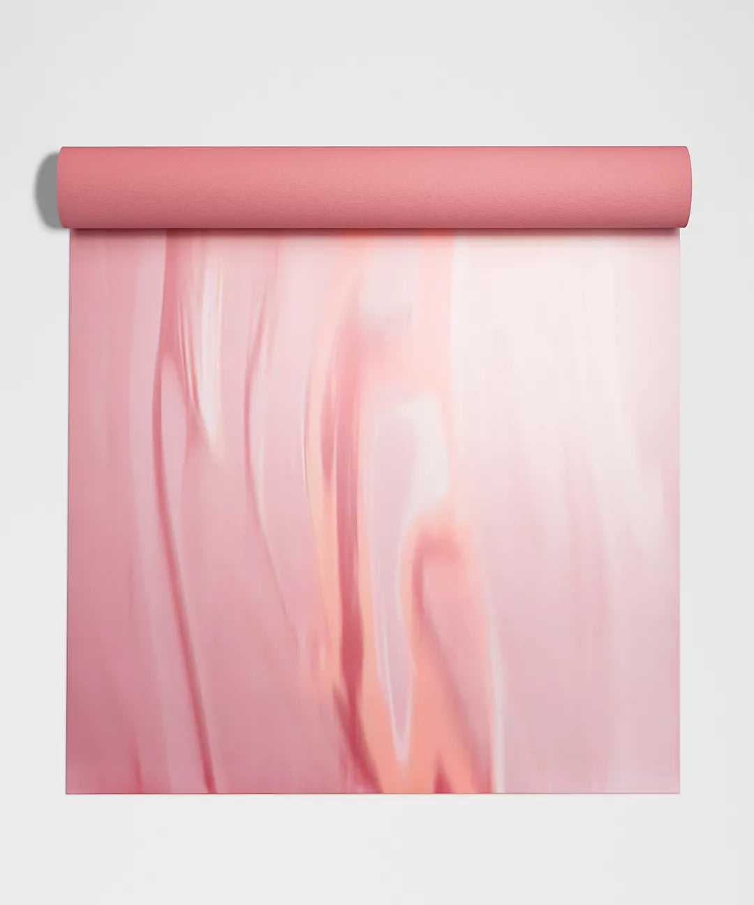 A pink yoga mat with a marbled pattern.